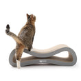 Load image into Gallery viewer, Tabby cat standing on the Nookaroo Agatha Infinity scratcher, rear view showing tail and scratch surface