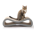 Load image into Gallery viewer, Tabby cat sitting on the Nookaroo Agatha Infinity lounge scratcher, front view