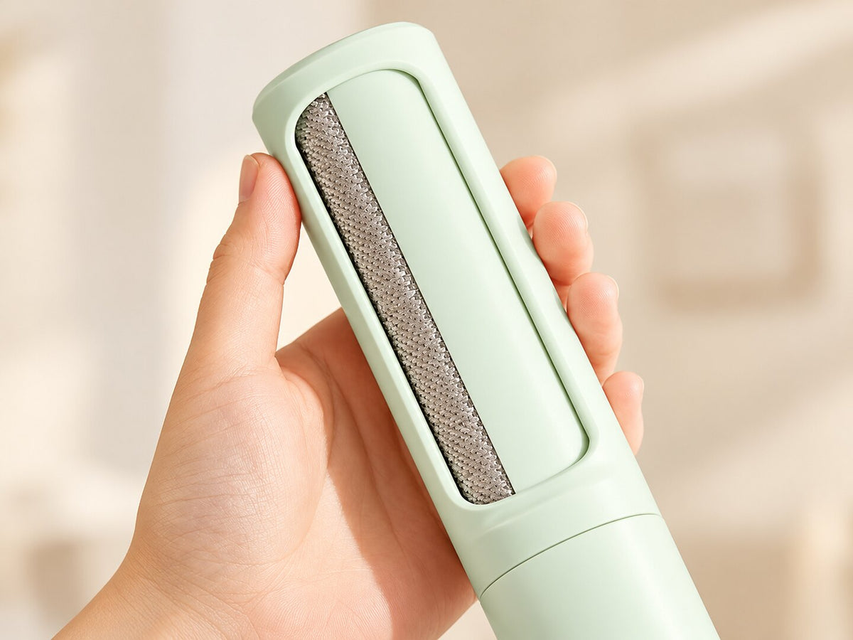 Rotating cover and woven lint-cleaning strip on the green brush — styled supplier image