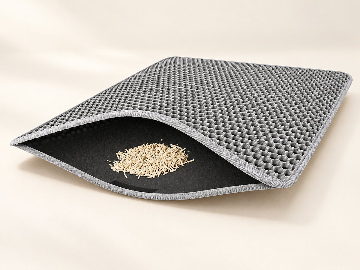 Opened gray litter mat showing honeycomb top and lower collection layer — styled supplier image