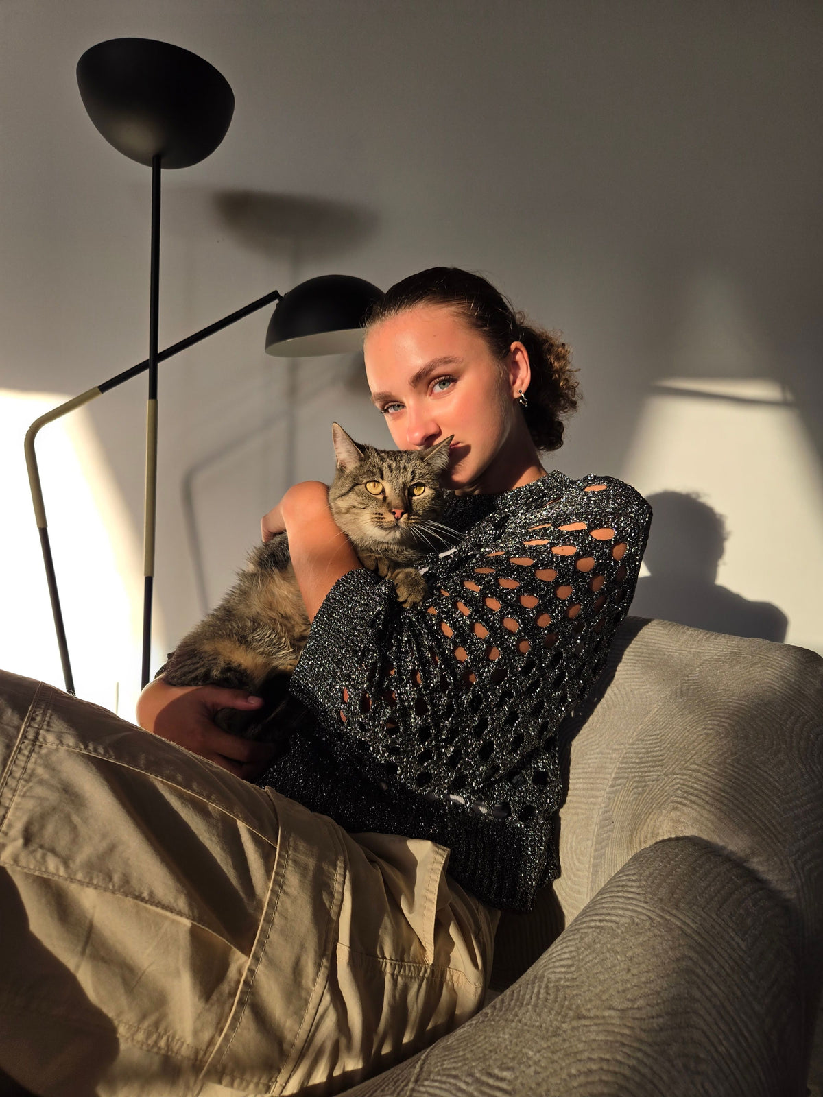 Veterinarian gently examining a cat during a wellness visit