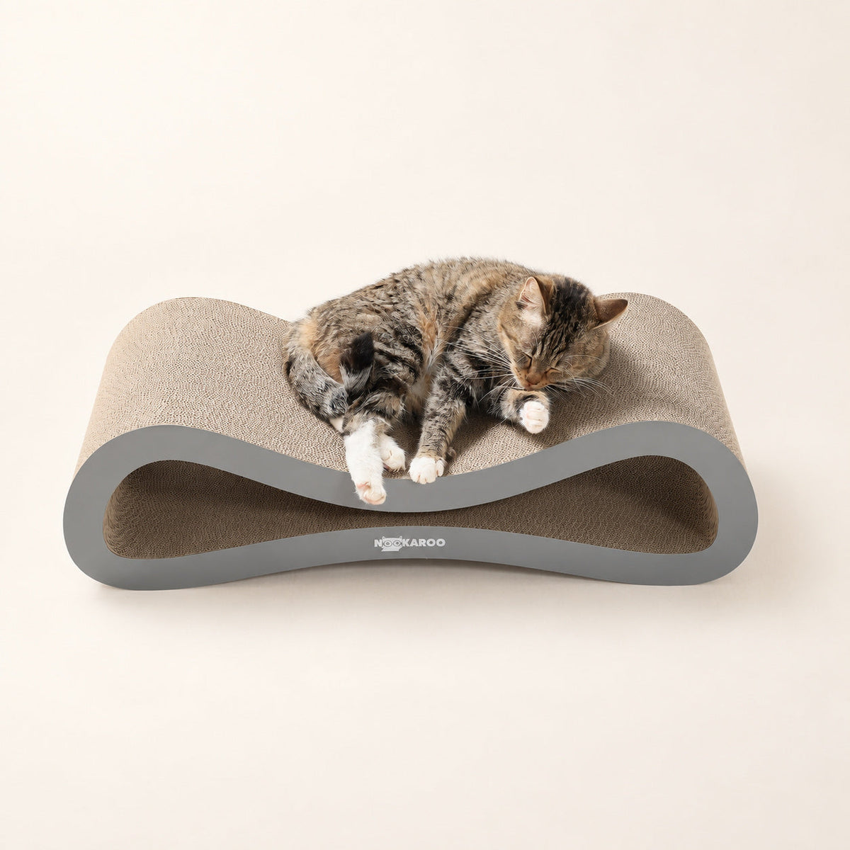 Tabby cat lounging on the Agatha scratcher included in the Nookaroo Signature Duo