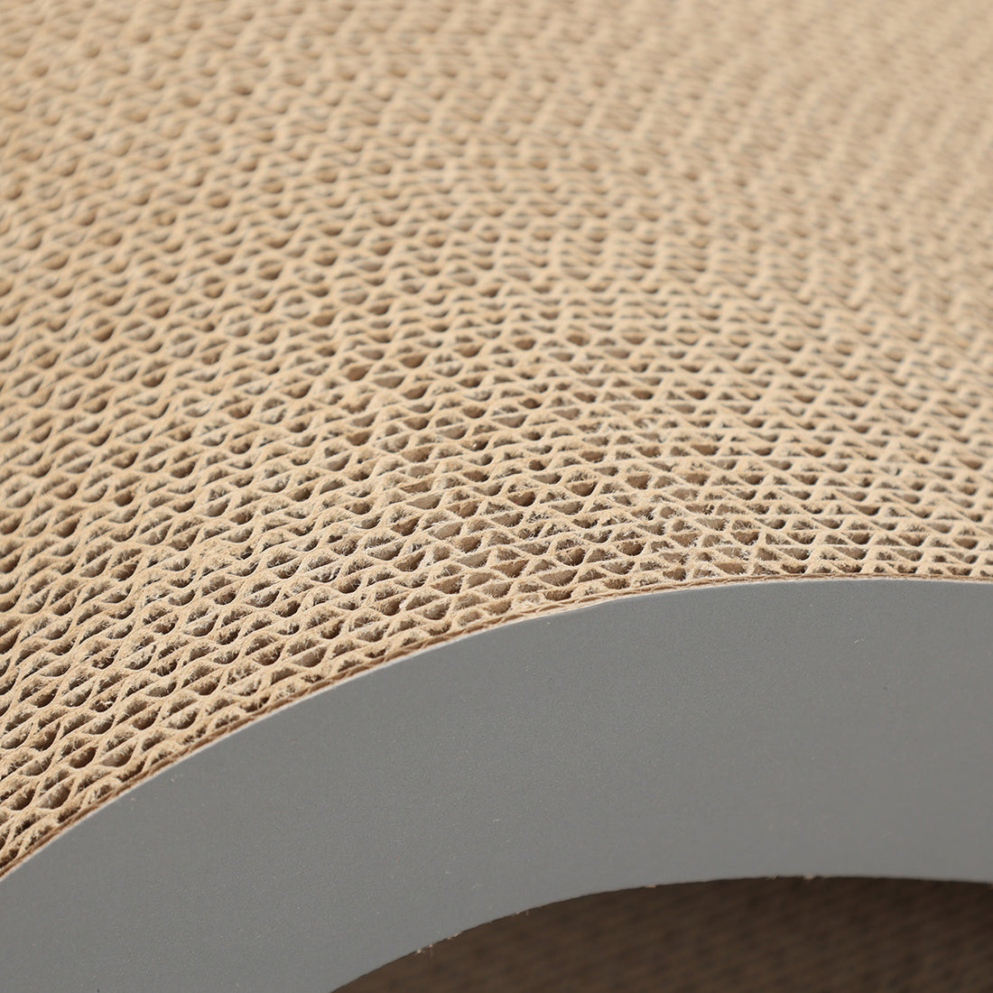 Close-up of Agatha's dense layered cardboard scratching surface