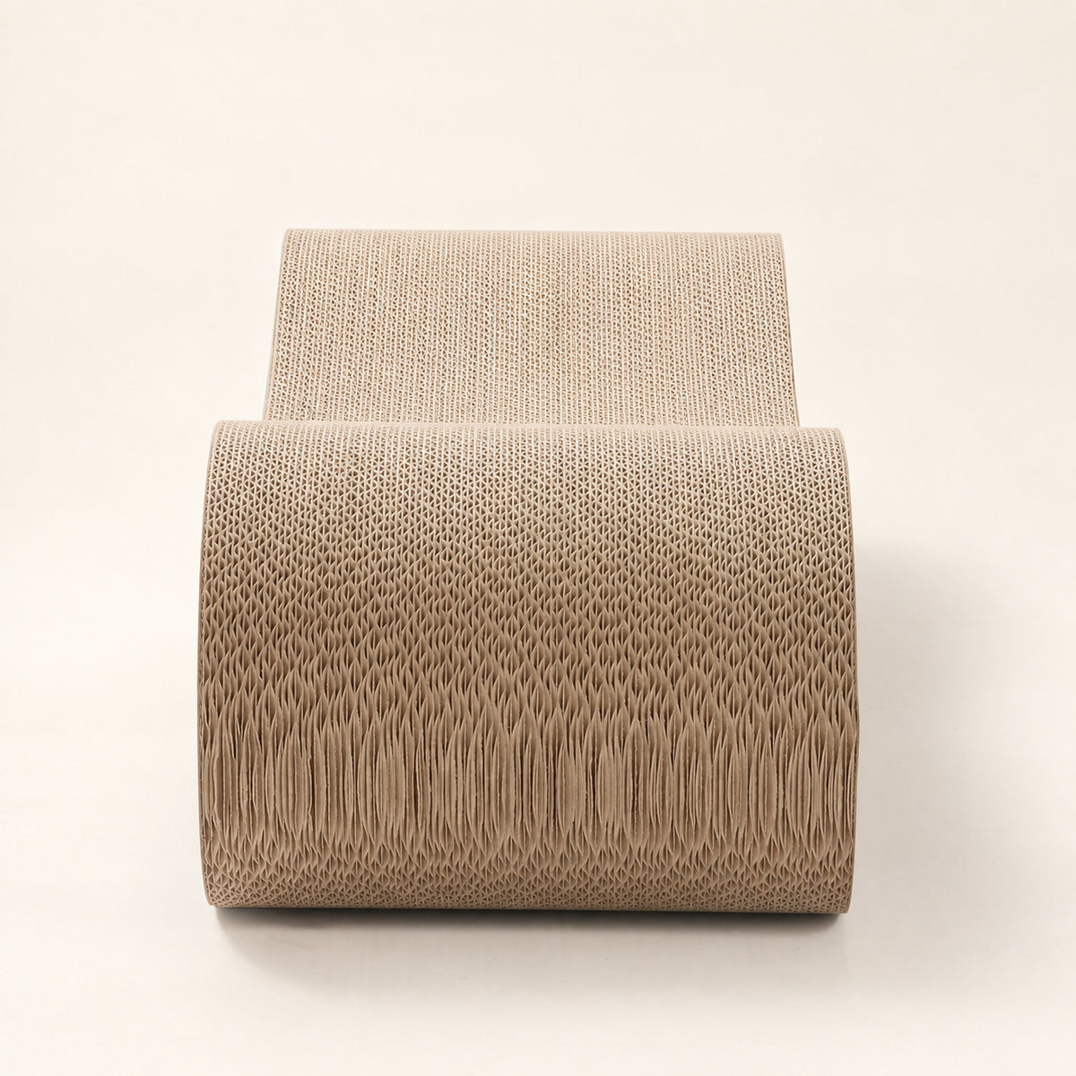 Front view of the Nookaroo Agatha infinity cat scratcher showing dense corrugated cardboard on a warm cream background