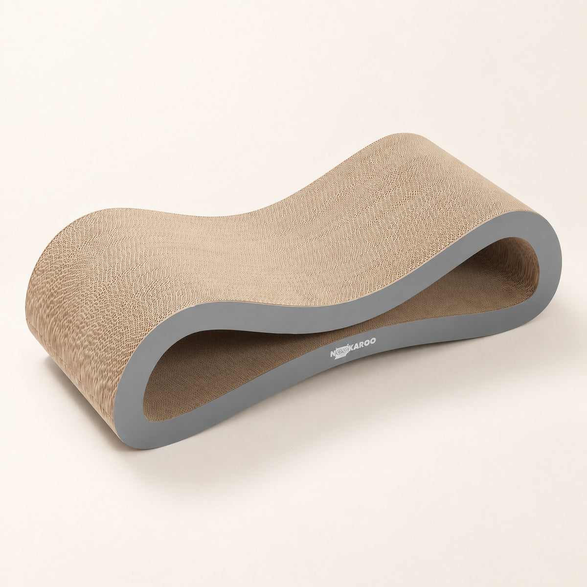 Three-quarter view of the Nookaroo Agatha infinity cat scratcher and lounge on a warm cream background
