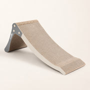 View image 3: Nookaroo Bennu convertible cat scratcher in its low ramp configuration on a warm cream background