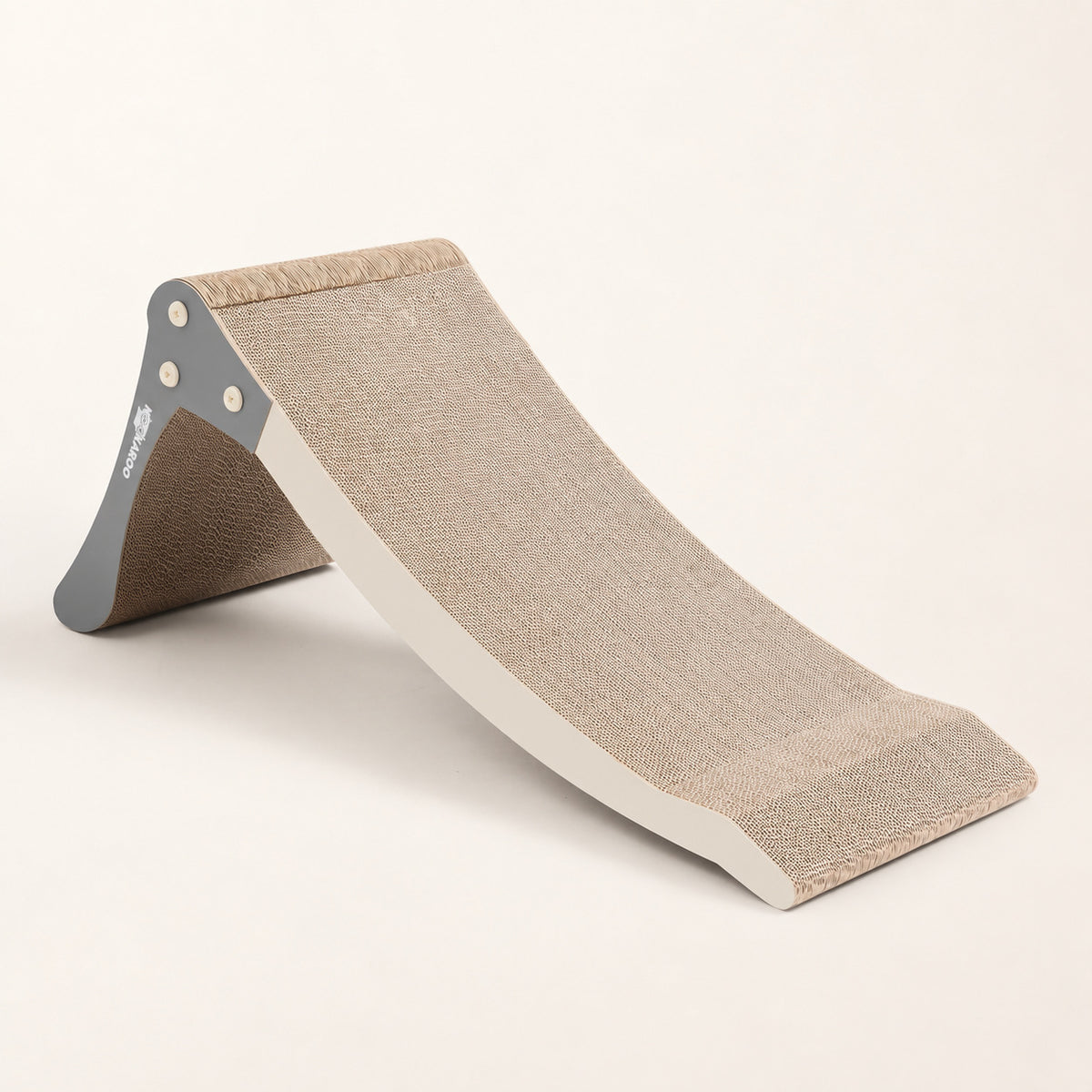 Nookaroo Bennu convertible cat scratcher in its low ramp configuration on a warm cream background