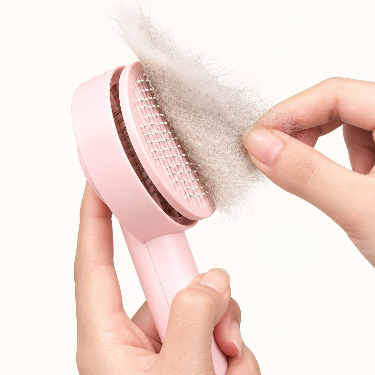 Removing collected fur from the pink brush cleaning plate