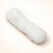 View image 2: White long-haired plush catnip pillow on a warm ivory background