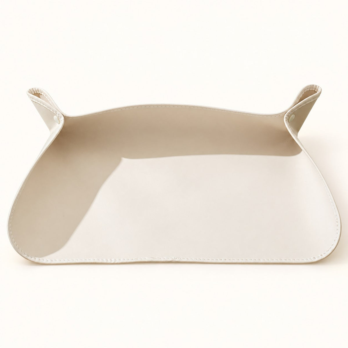 Cream fold-up feeding mat with snap fasteners and raised edges; one mat included