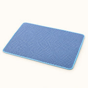 View image 3: Tidy Paws Double-Layer Litter Mat in blue on a warm ivory background; color reference, choose dimensions separately