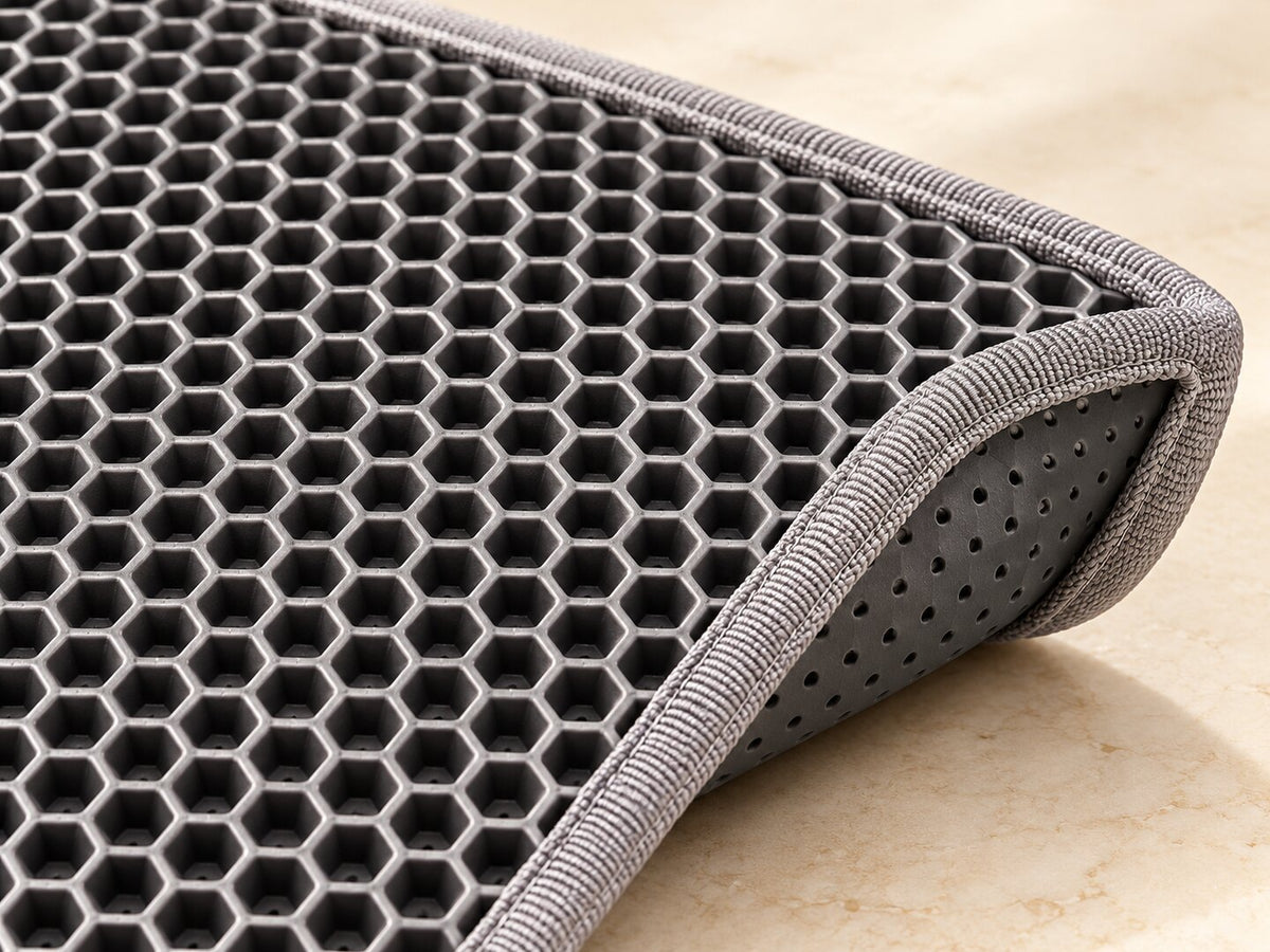 Close detail of gray EVA honeycomb surface and bound edge — styled supplier image