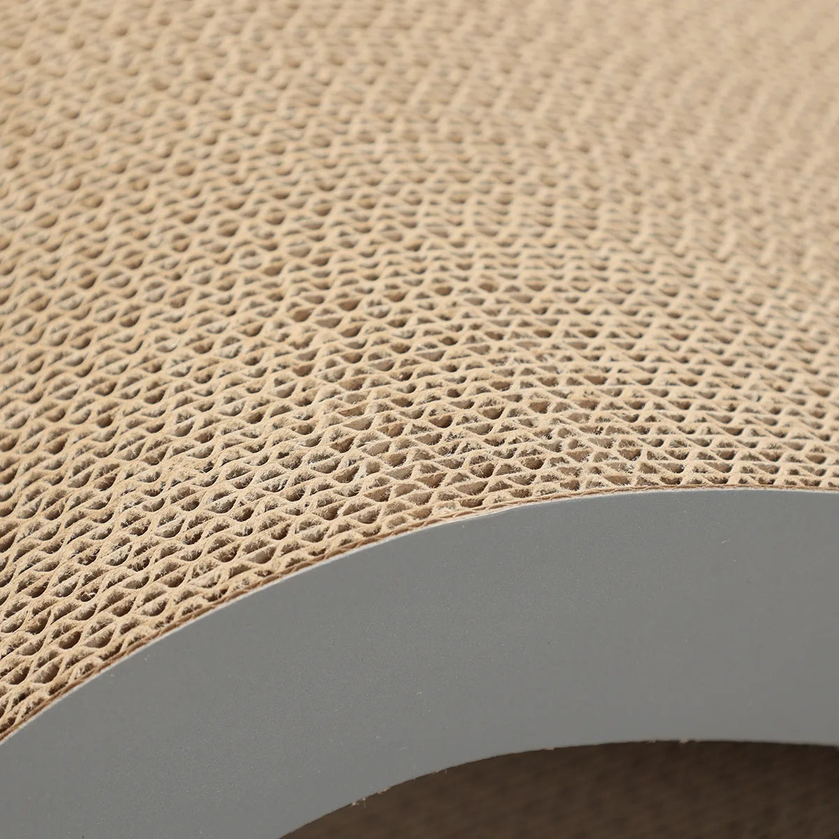 Close detail of the dense corrugated cardboard and graphite sidewall on Agatha