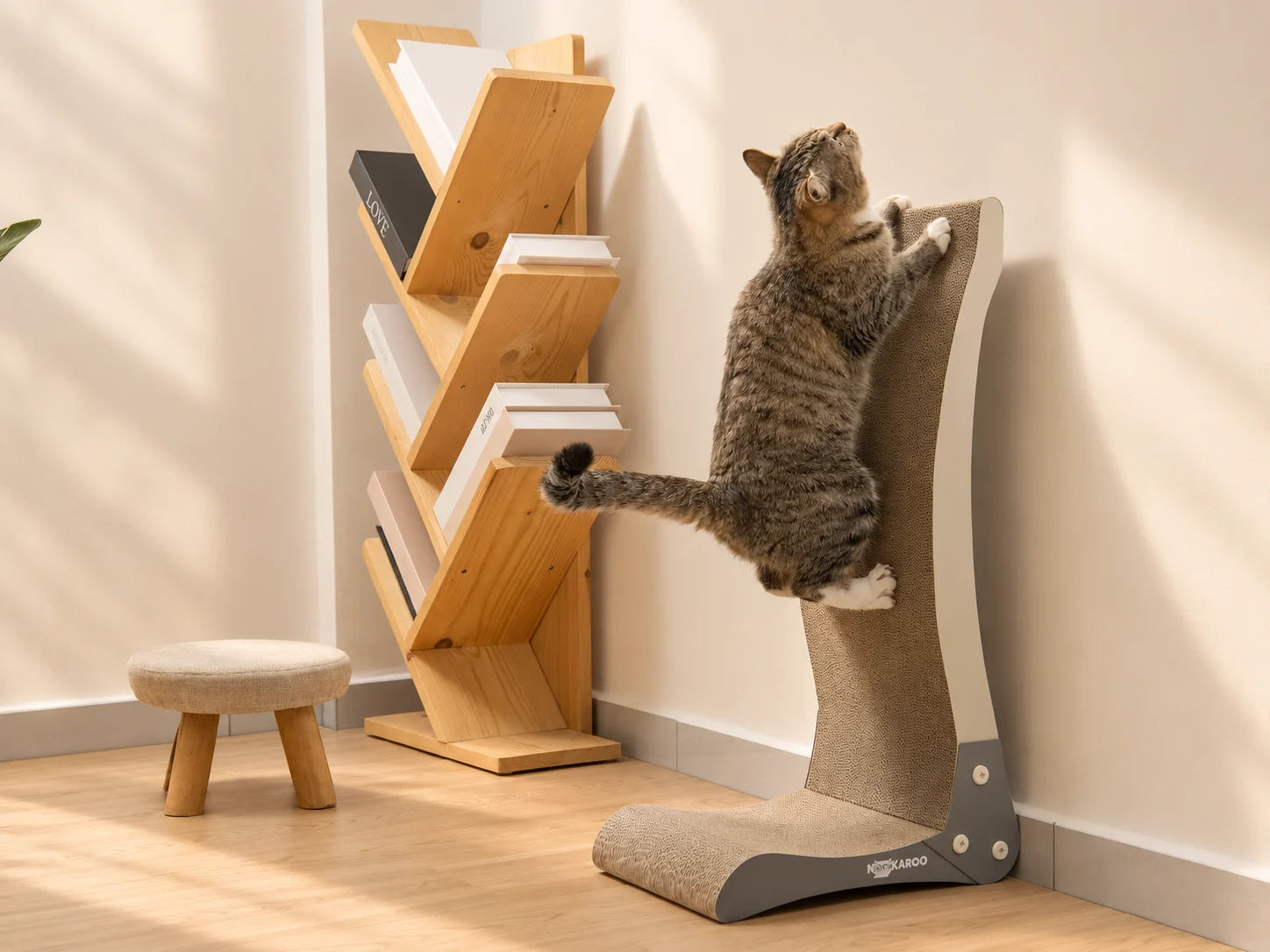 Tabby cat stretching upward on the Bennu vertical scratcher